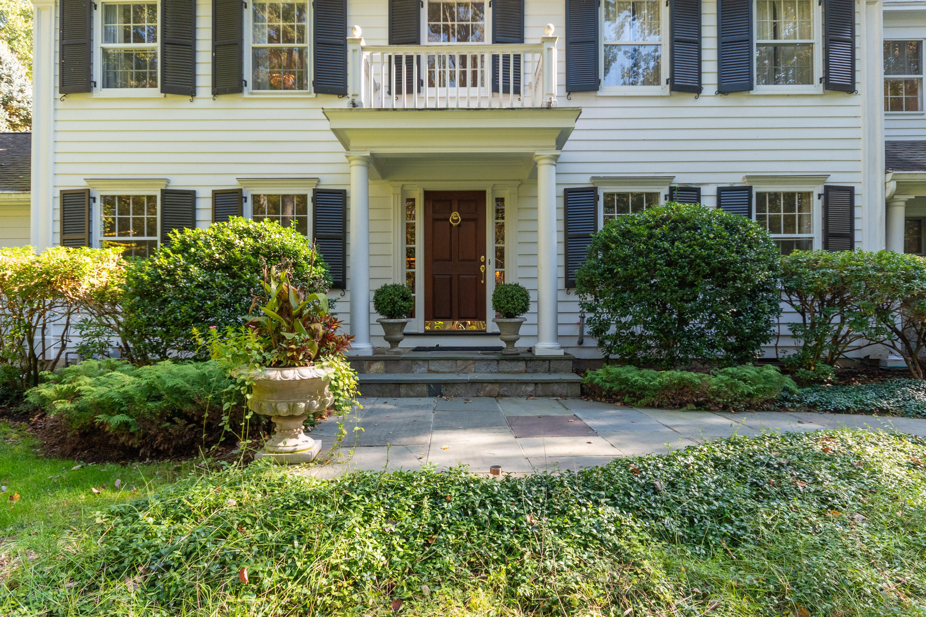 16 Shagbark Road Darien, CT 06820 - Photo 5 of 55 a front view of a house with a garden