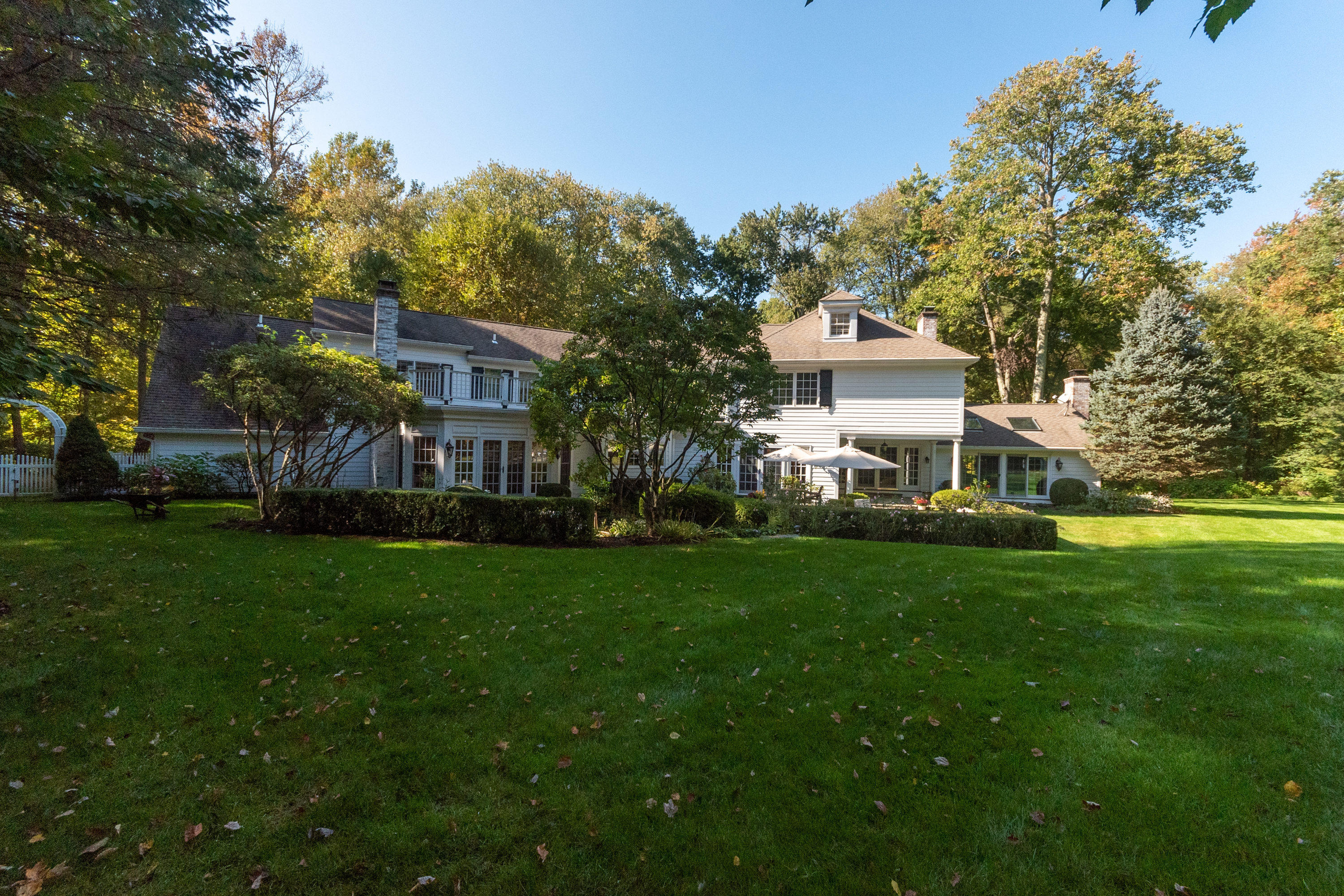 16 Shagbark Road Darien, CT 06820 - Photo 42 of 55 a front view of a residential houses with yard and green space