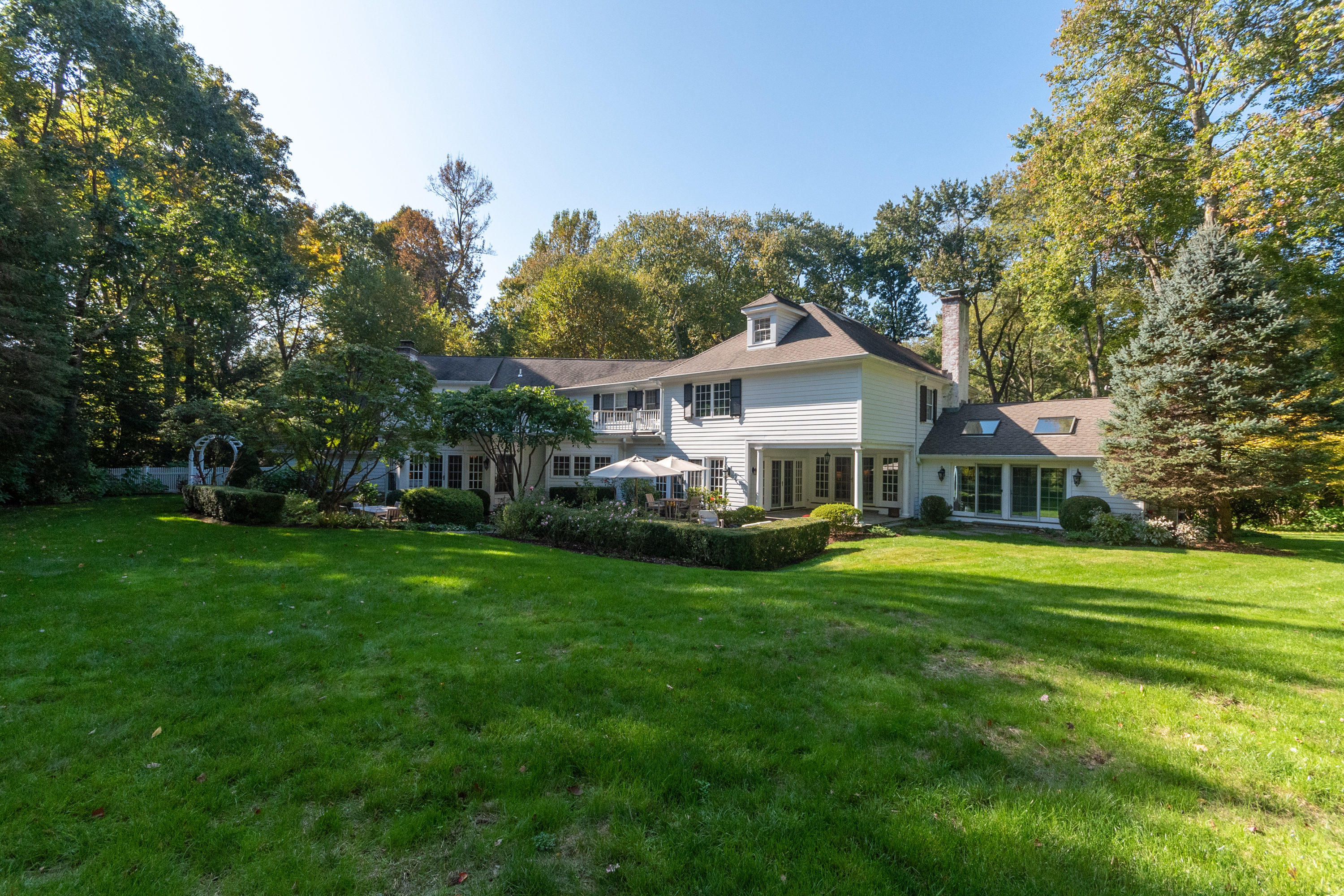 16 Shagbark Road Darien, CT 06820 - Photo 43 of 55 a front view of a house with a garden