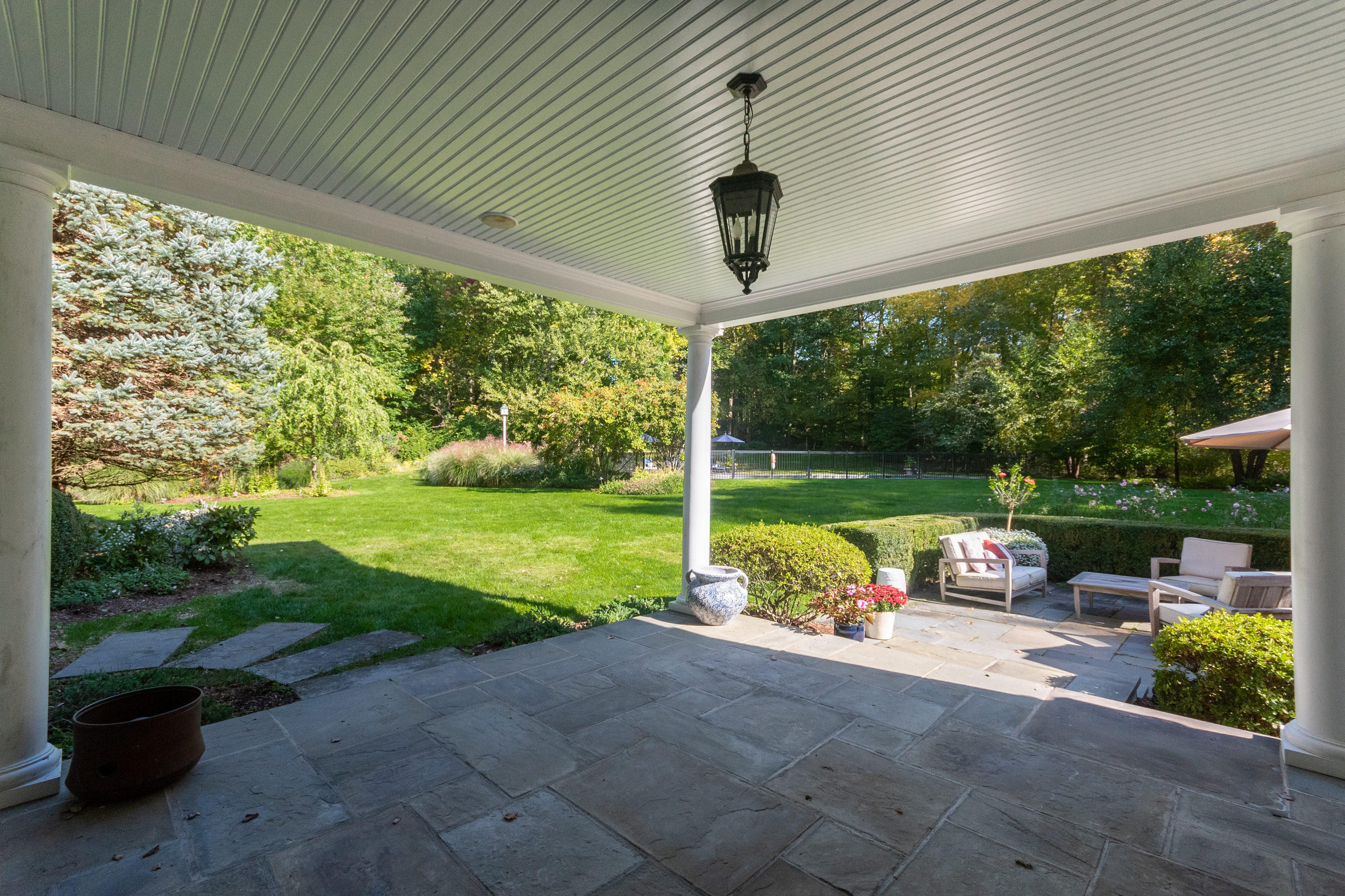 16 Shagbark Road Darien, CT 06820 - Photo 44 of 55 a view of a porch with furniture and yard