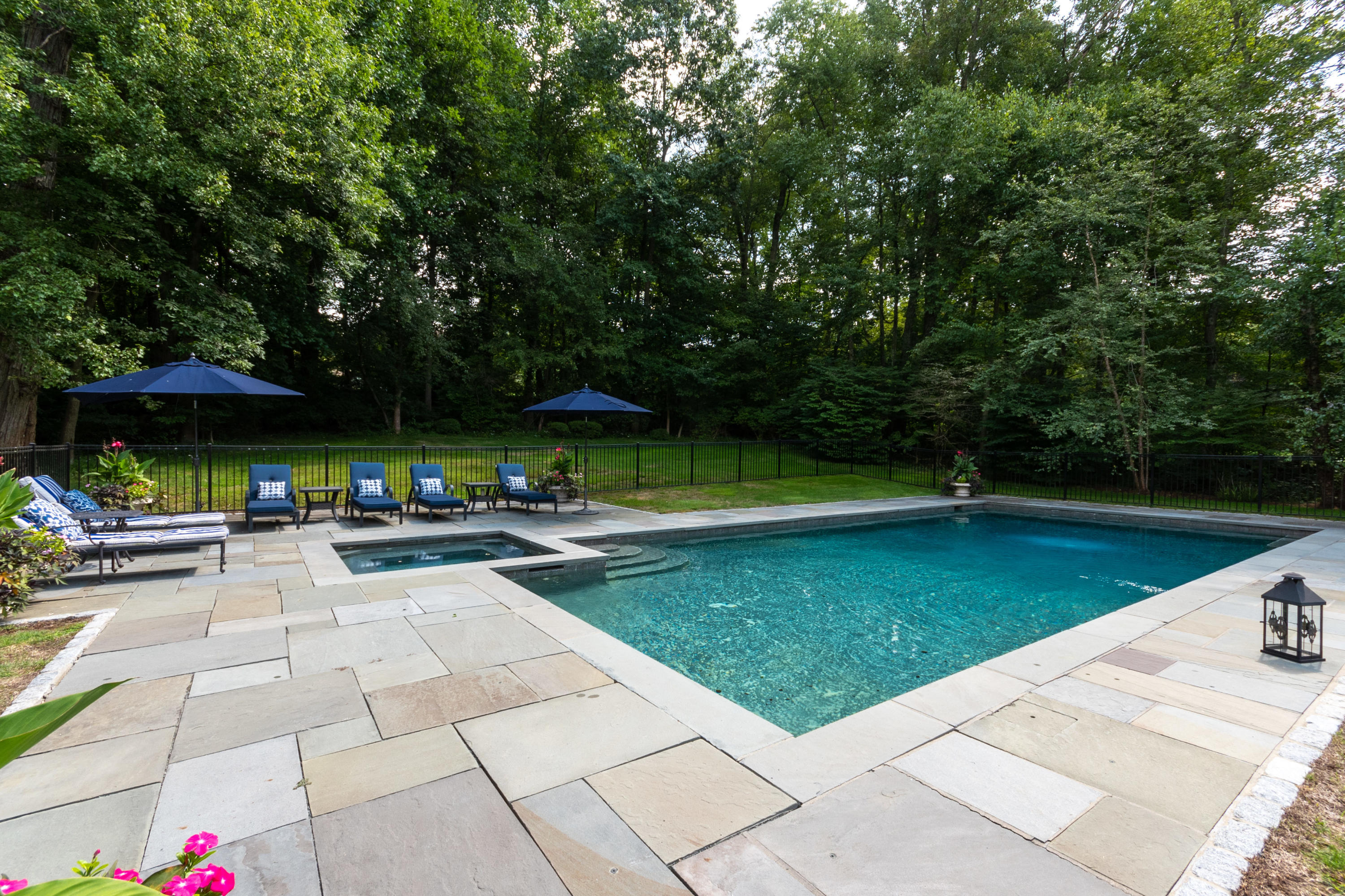 16 Shagbark Road Darien, CT 06820 - Photo 49 of 55 a view of a swimming pool with a patio