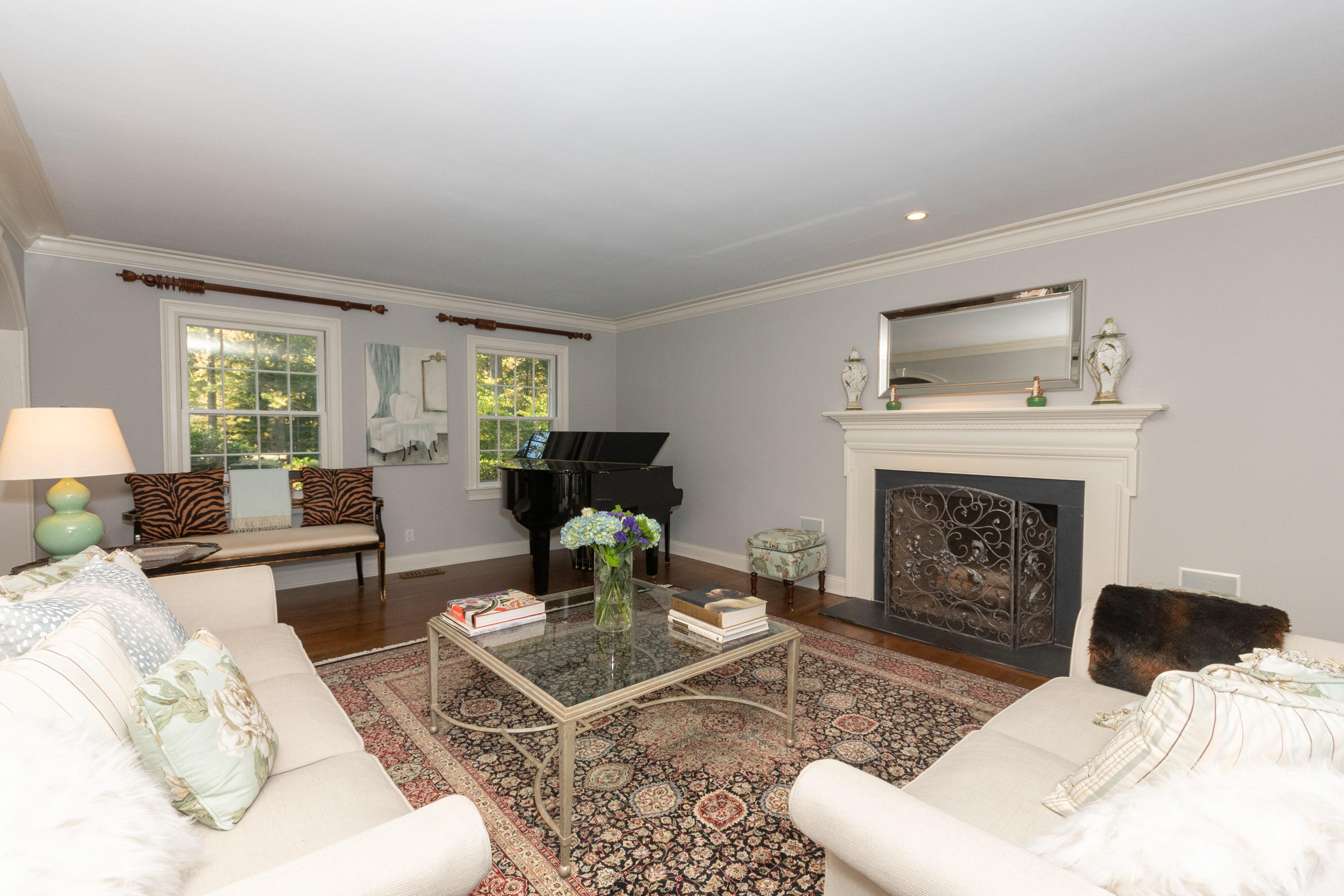 16 Shagbark Road Darien, CT 06820 - Photo 10 of 55 a living room with furniture a fireplace and a table