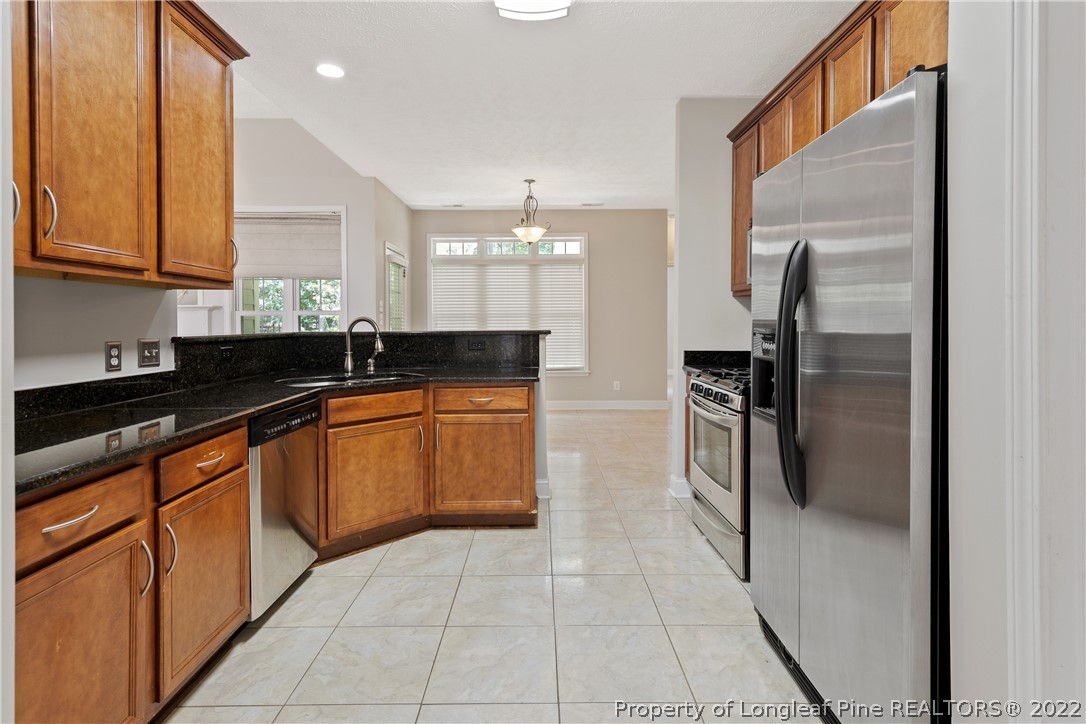 95 Crystal Point Sanford, NC 27332 - Photo 11 of 33 a kitchen with a refrigerator sink and cabinets