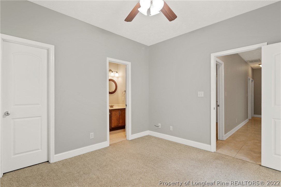 95 Crystal Point Sanford, NC 27332 - Photo 20 of 33 an empty room with closet and a chandelier fan
