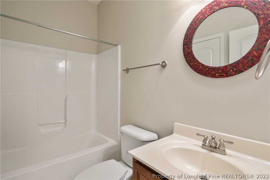 95 Crystal Point Sanford, NC 27332 - Photo 24 of 33 a bathroom with a sink and a mirror