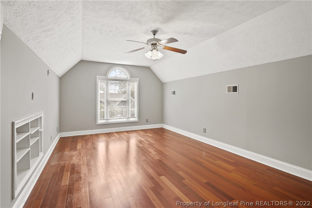 95 Crystal Point Sanford, NC 27332 - Photo 28 of 33 a view of an empty room with wooden floor and a window