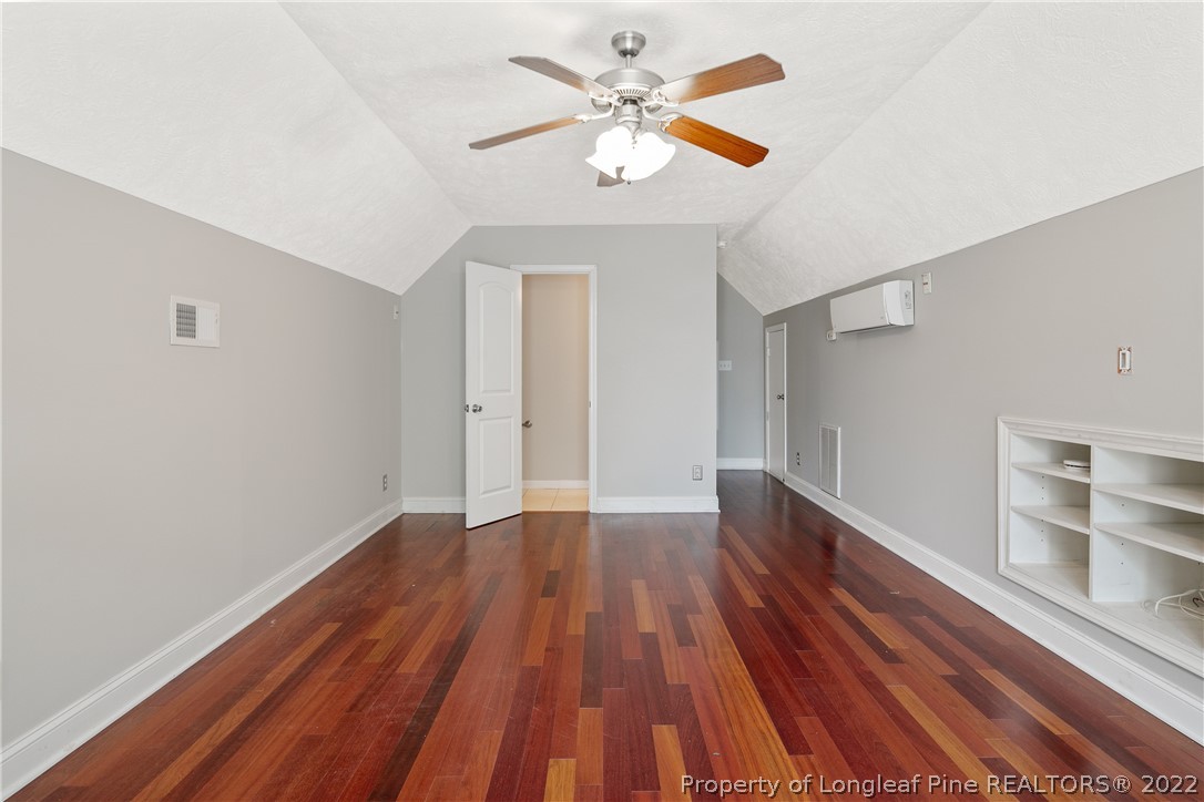 95 Crystal Point Sanford, NC 27332 - Photo 30 of 33 wooden floor in an empty room with a window