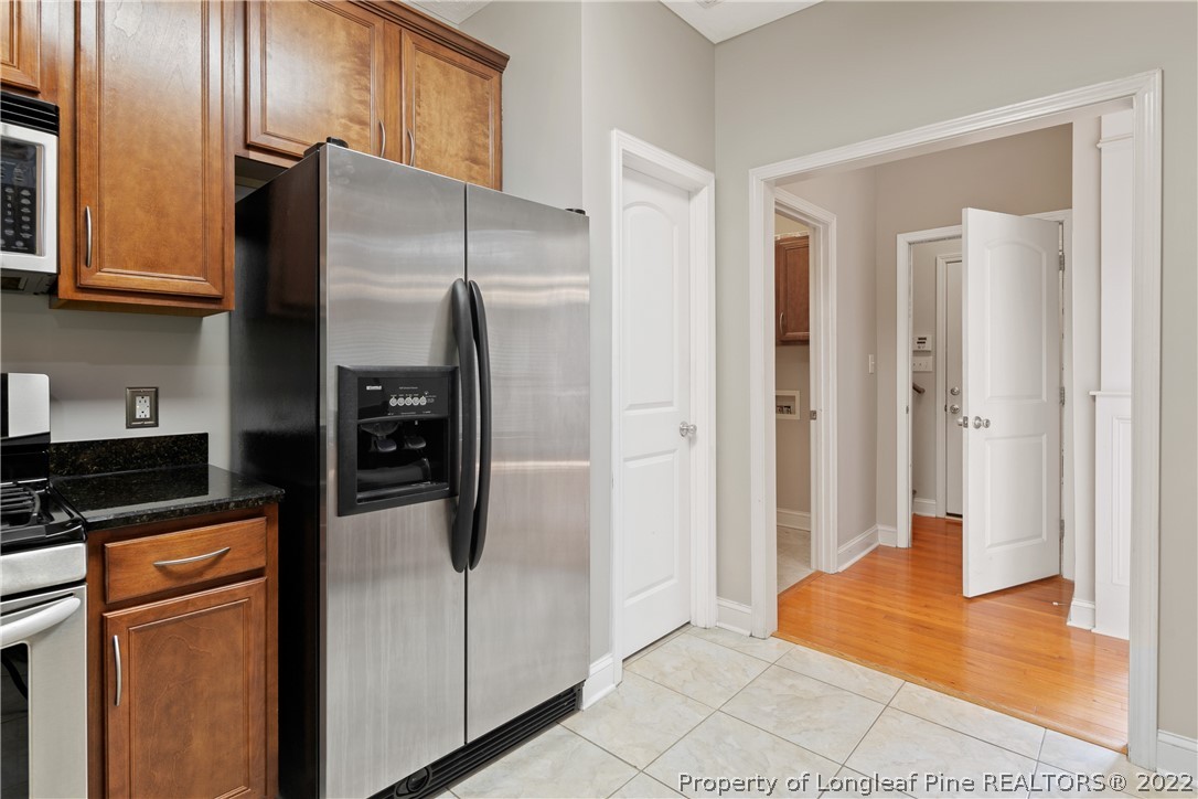 95 Crystal Point Sanford, NC 27332 - Photo 10 of 33 a kitchen with stainless steel appliances granite countertop a refrigerator and a sink