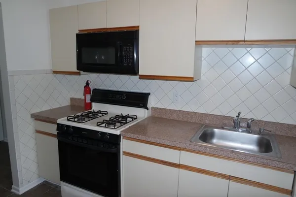 a kitchen with a stove and a sink
