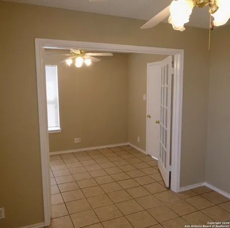 a view of empty room with windows