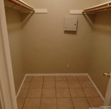 a bathroom with a toilet and shower