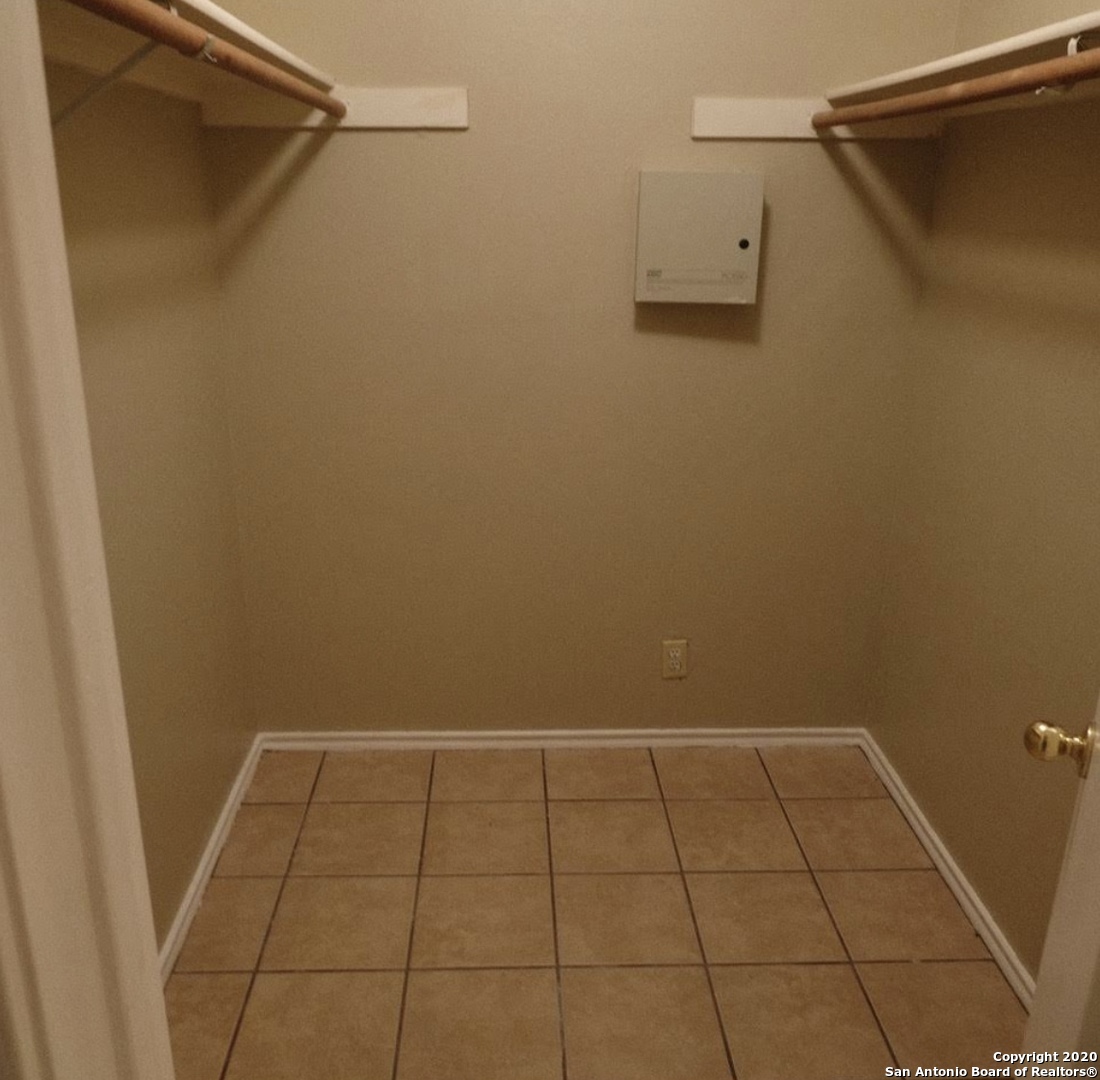 9818 Autumn Valley Converse, TX 78109 - Photo 14 of 21 a view of a room with racks on the wall