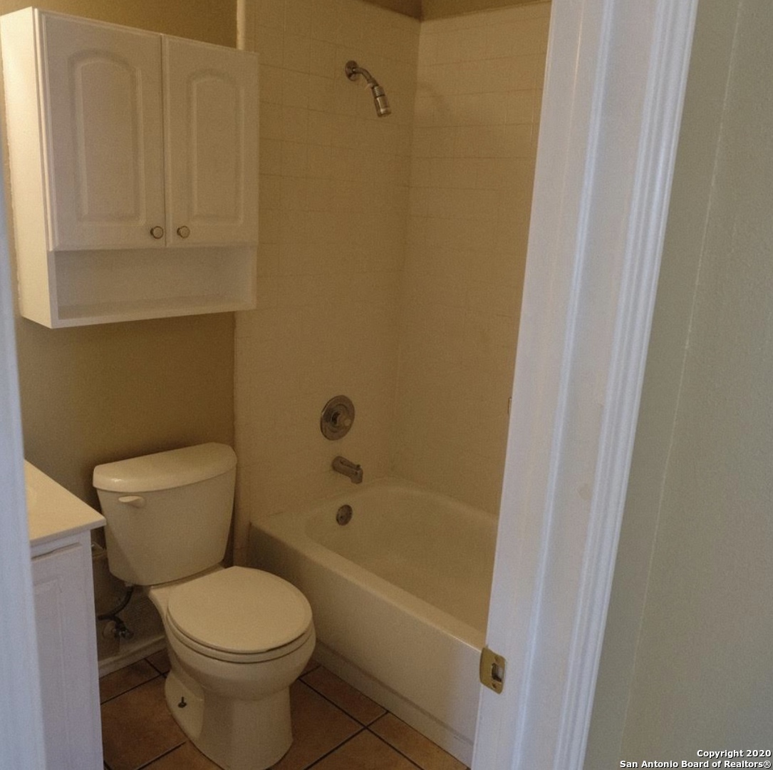 9818 Autumn Valley Converse, TX 78109 - Photo 15 of 21 a bathroom with a toilet and shower