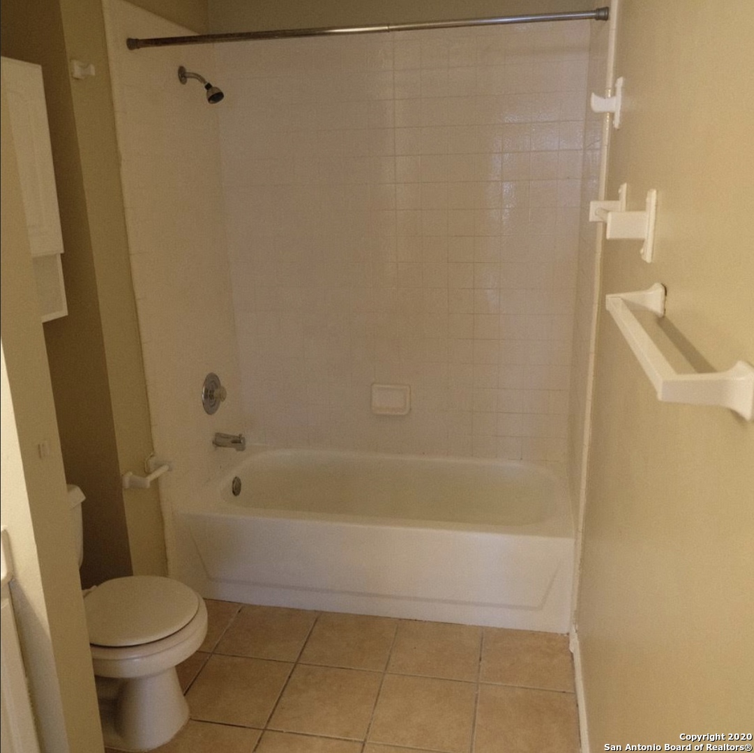 9818 Autumn Valley Converse, TX 78109 - Photo 18 of 21 a bathroom with a shower and a toilet