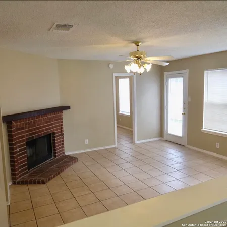 a view of a livingroom with an empty space and a window