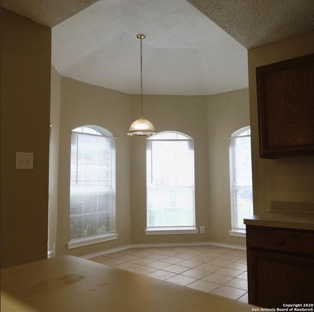 9818 Autumn Valley Converse, TX 78109 - Photo 10 of 21 a view of an empty room with a window