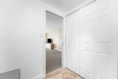 a view of a bathroom from a hallway