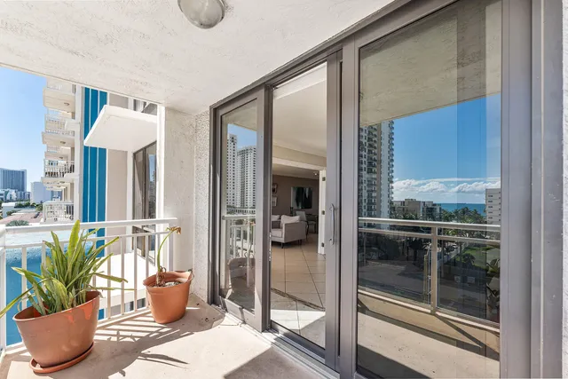a room with wooden floor and glass door