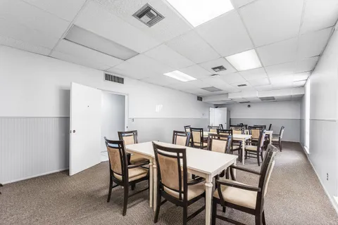 a view of a dining room with furniture