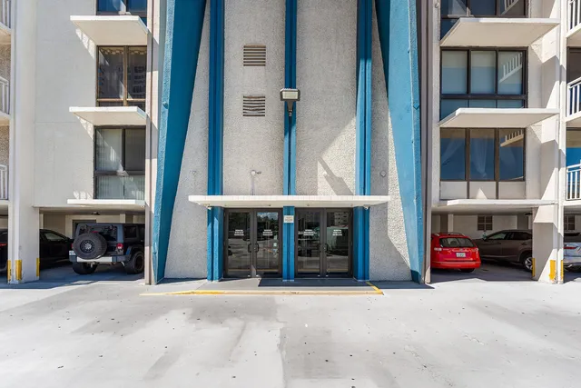 a view of a car park in front of building