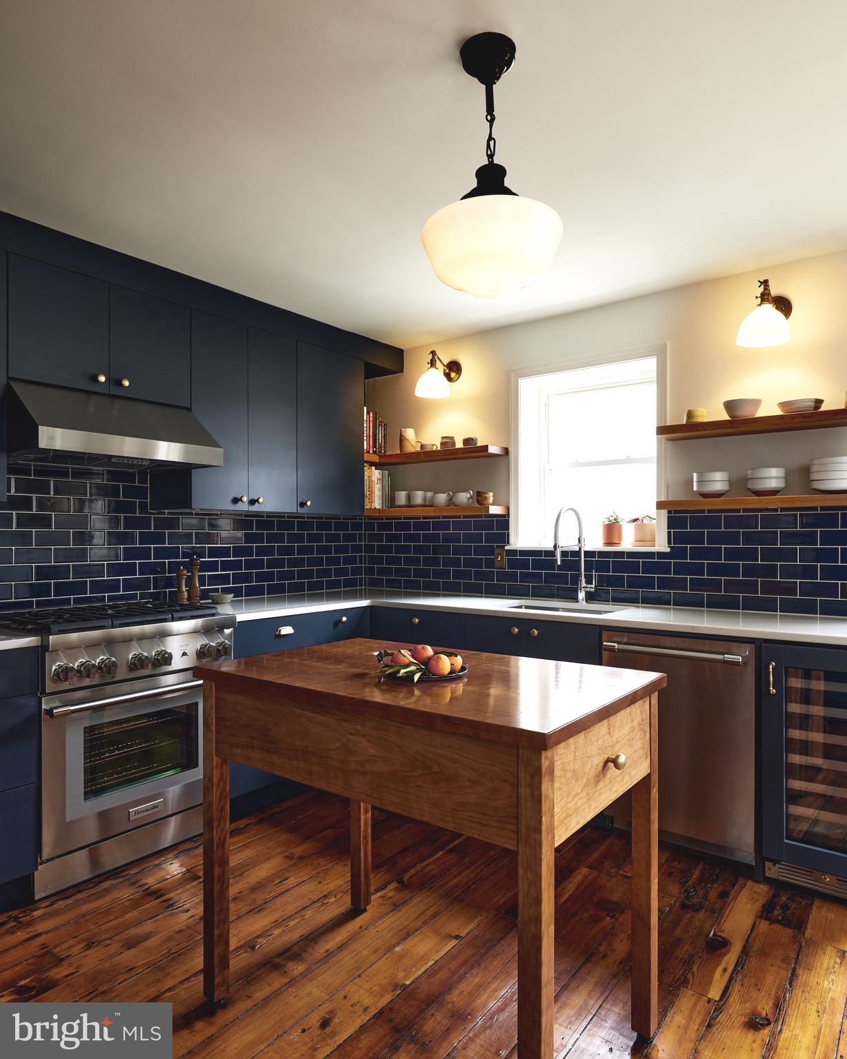 a kitchen with a counter space a sink and appliances
