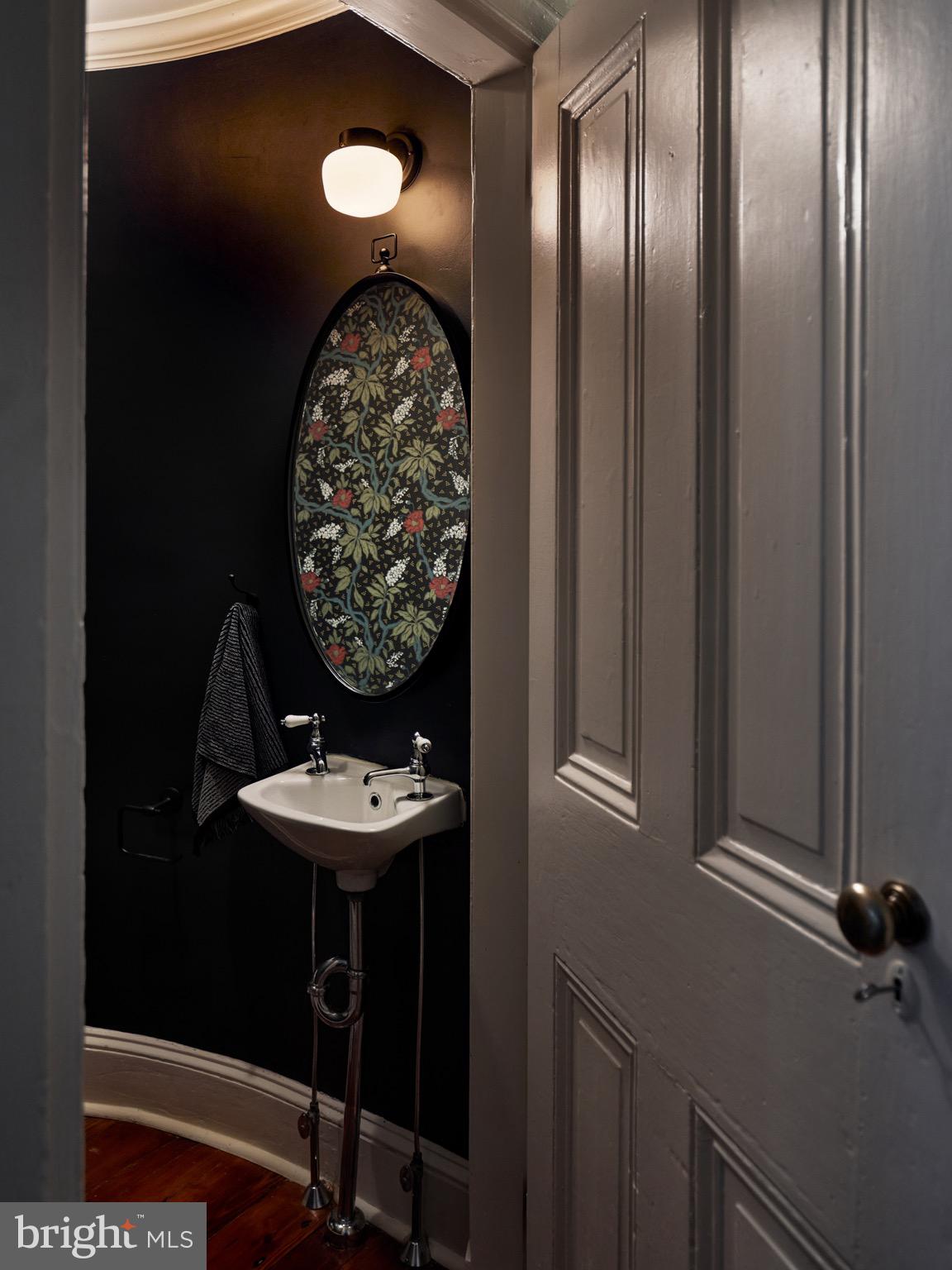 978 North 5th Street Philadelphia, PA 19123 - Photo 16 of 36 a bathroom with a sink and a mirror