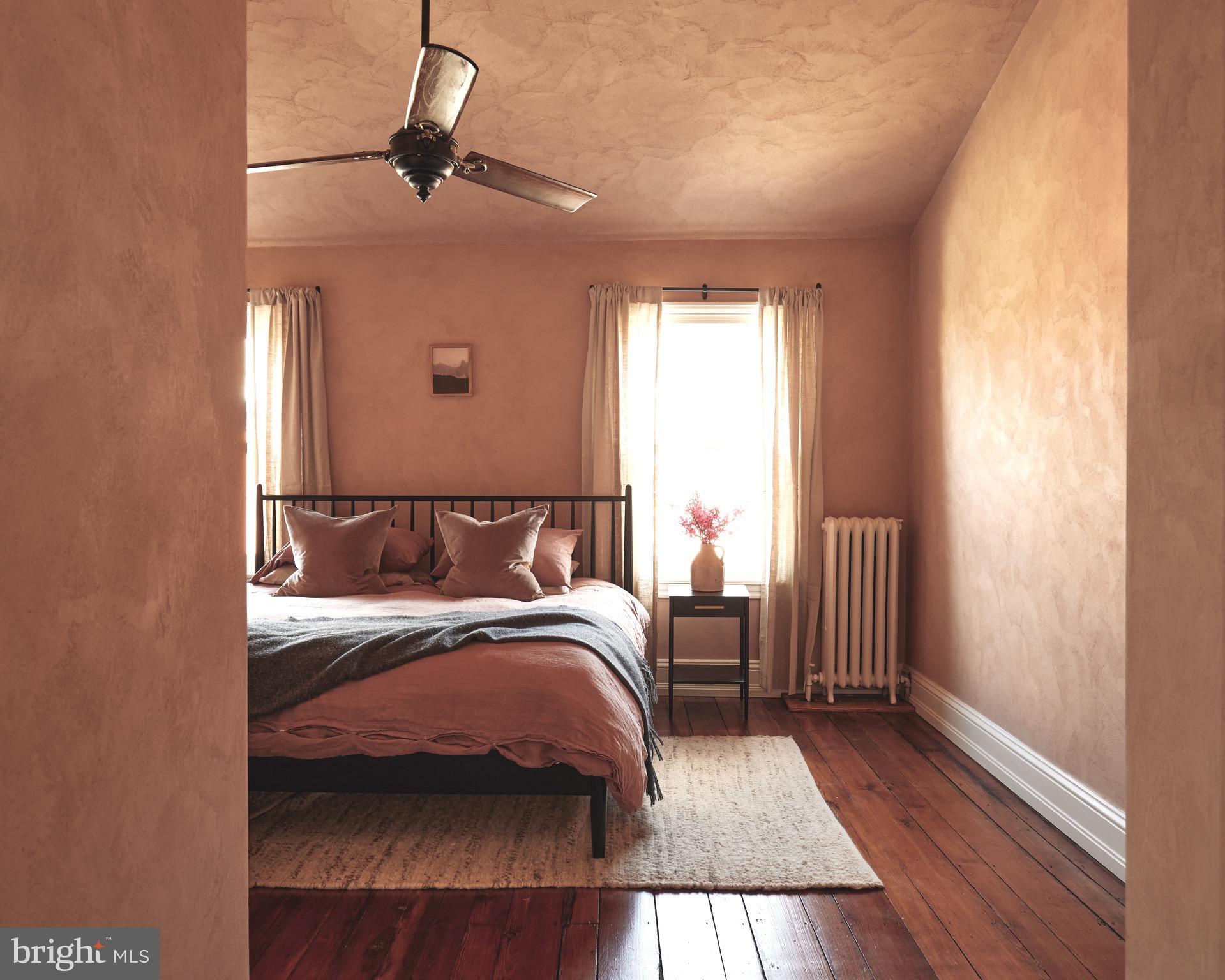 978 North 5th Street Philadelphia, PA 19123 - Photo 18 of 36 a bedroom with a large bed and a window