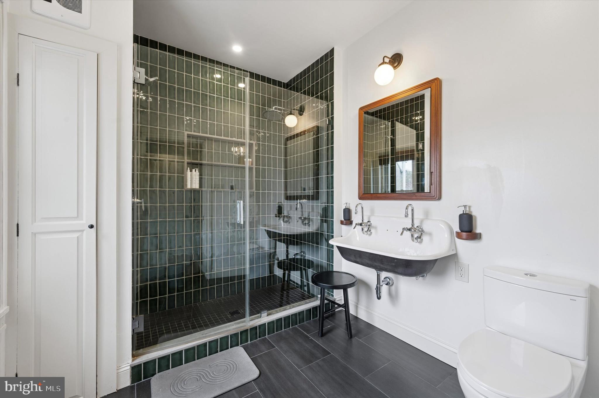 978 North 5th Street Philadelphia, PA 19123 - Photo 21 of 36 a bathroom with a sink a toilet and shower