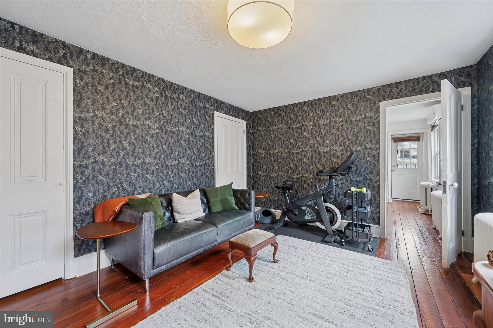 978 North 5th Street Philadelphia, PA 19123 - Photo 27 of 36 a living room with furniture and a wooden floor
