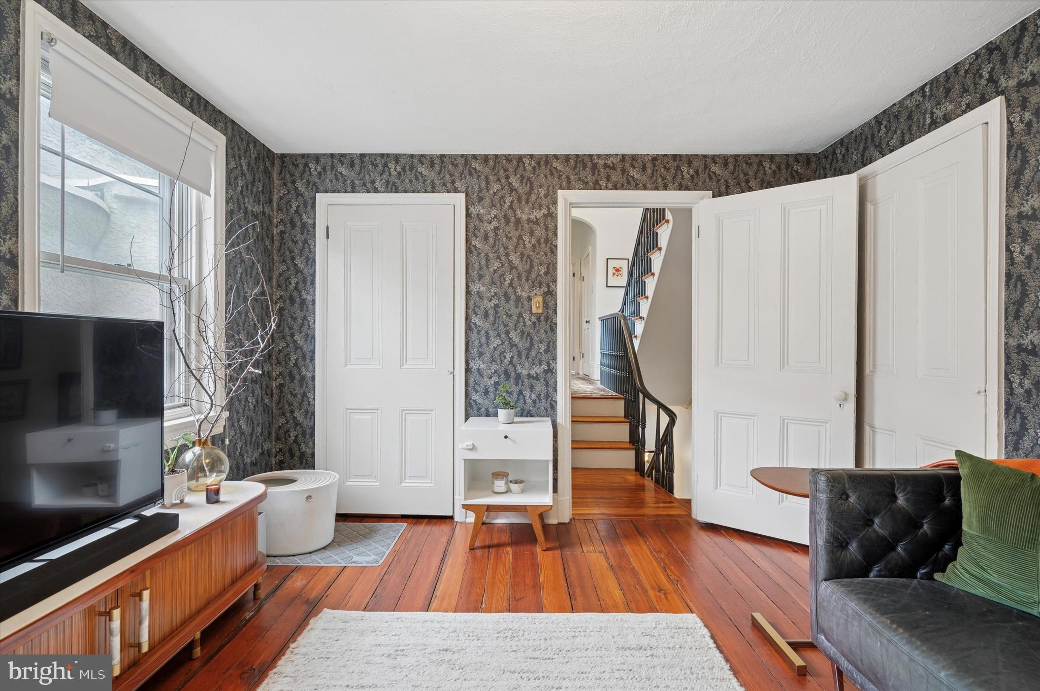978 North 5th Street Philadelphia, PA 19123 - Photo 28 of 36 a living room with furniture and a flat screen tv