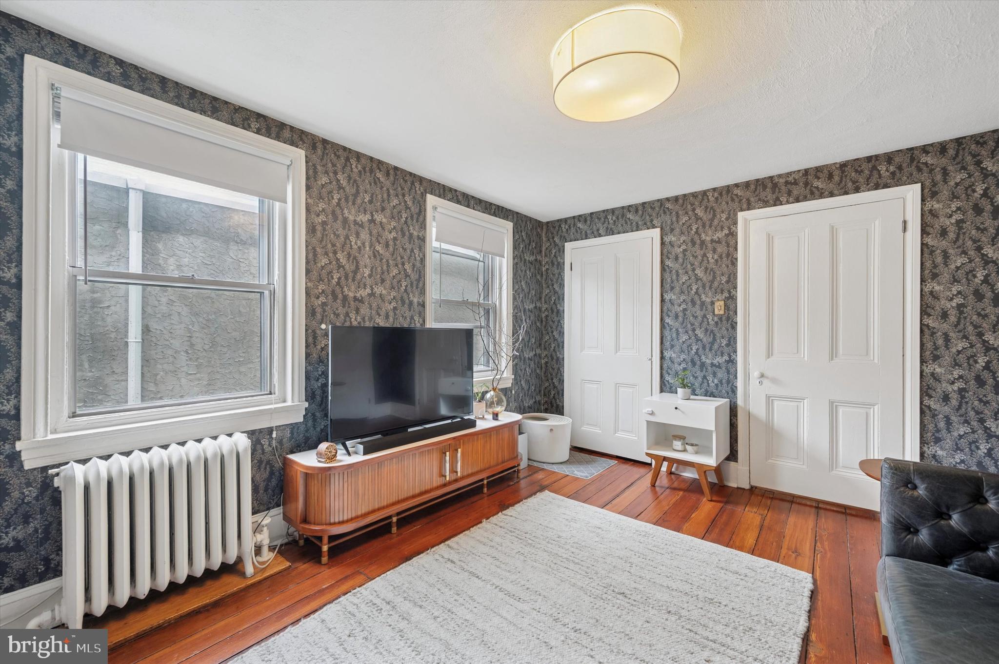 978 North 5th Street Philadelphia, PA 19123 - Photo 29 of 36 a living room with furniture and a flat screen tv