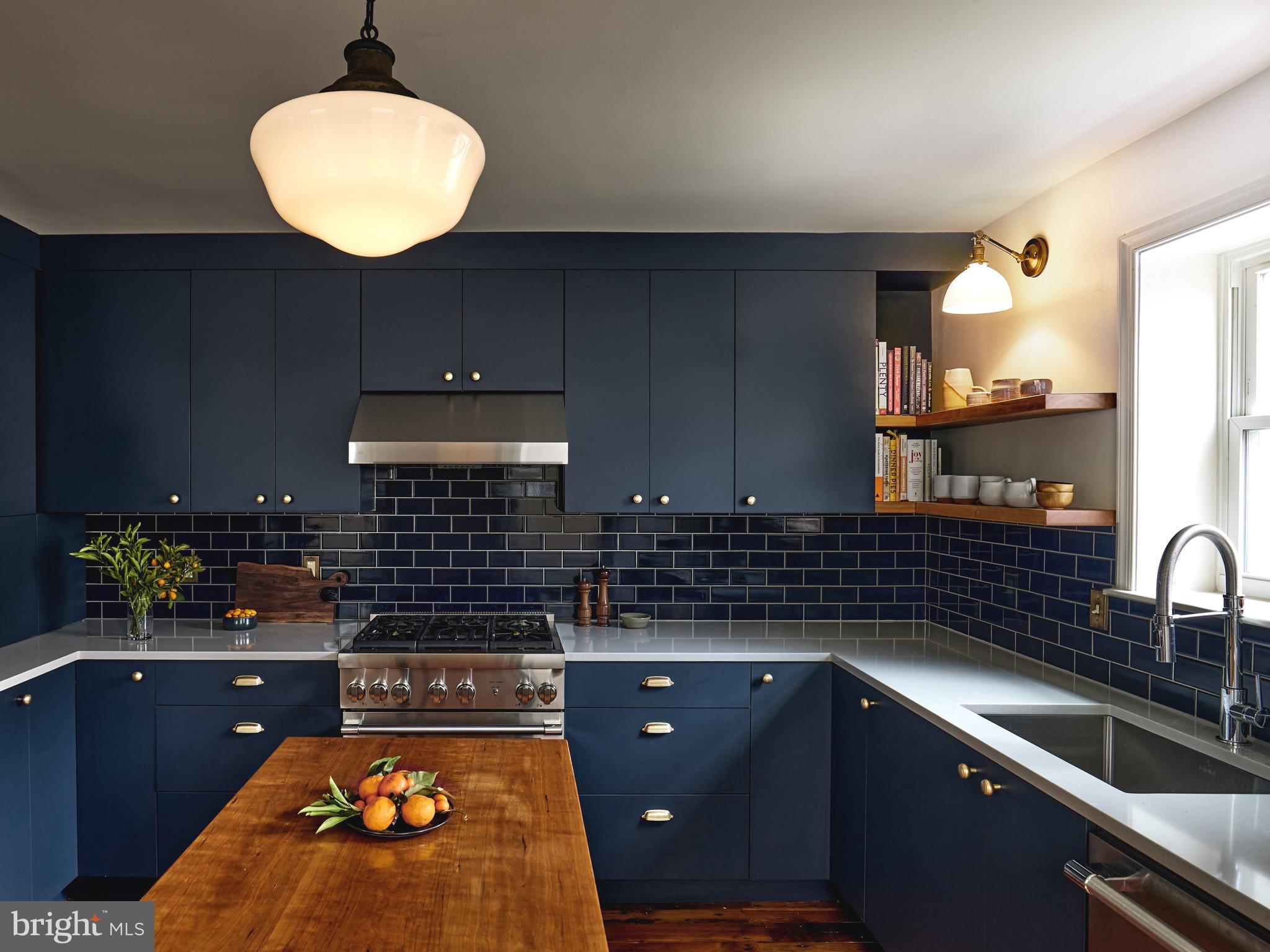 978 North 5th Street Philadelphia, PA 19123 - Photo 3 of 36 a kitchen with a sink and cabinets