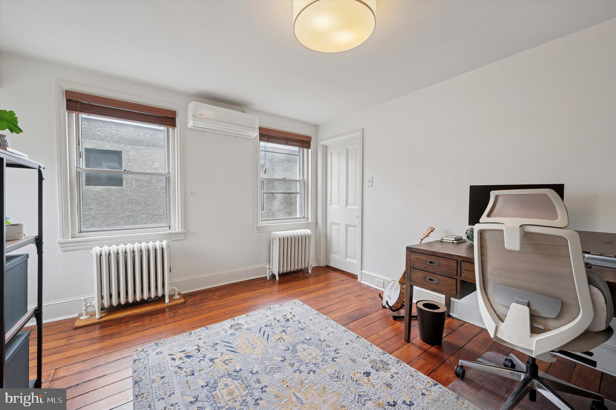 978 North 5th Street Philadelphia, PA 19123 - Photo 31 of 36 a view of a workspace with furniture and a window