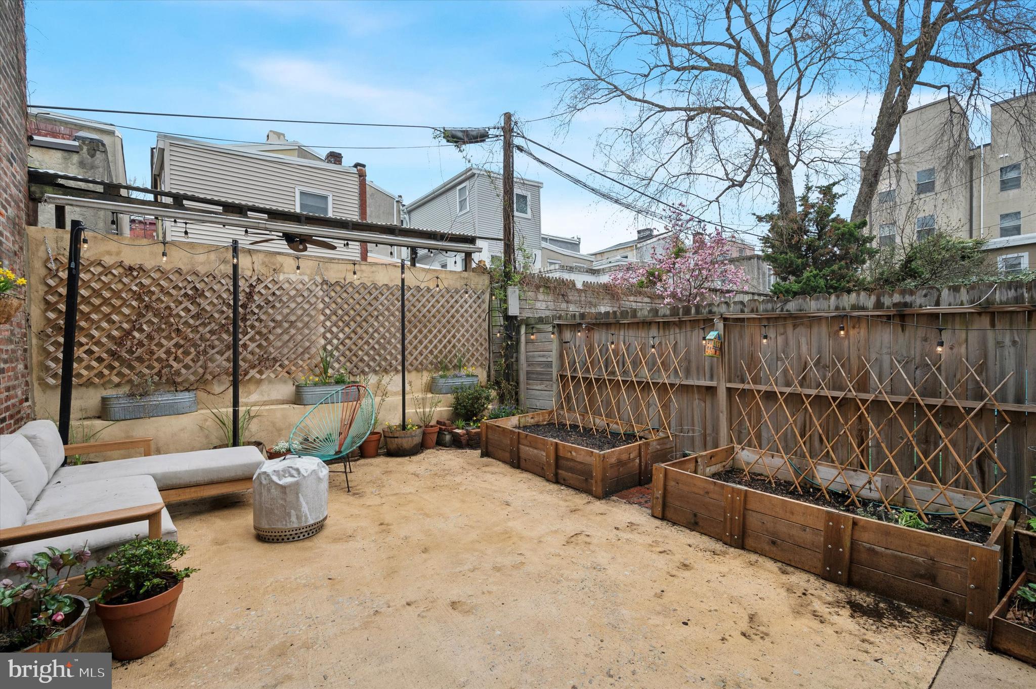 978 North 5th Street Philadelphia, PA 19123 - Photo 34 of 36 a view of a roof deck with couches and potted plants