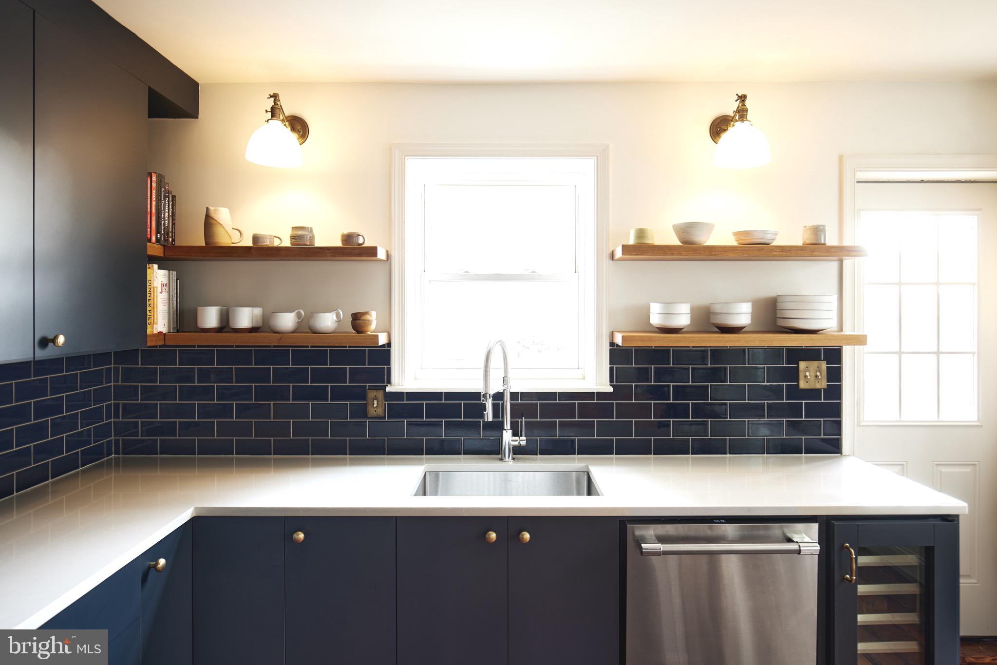 978 North 5th Street Philadelphia, PA 19123 - Photo 5 of 36 a view of a kitchen with a sink and cabinets