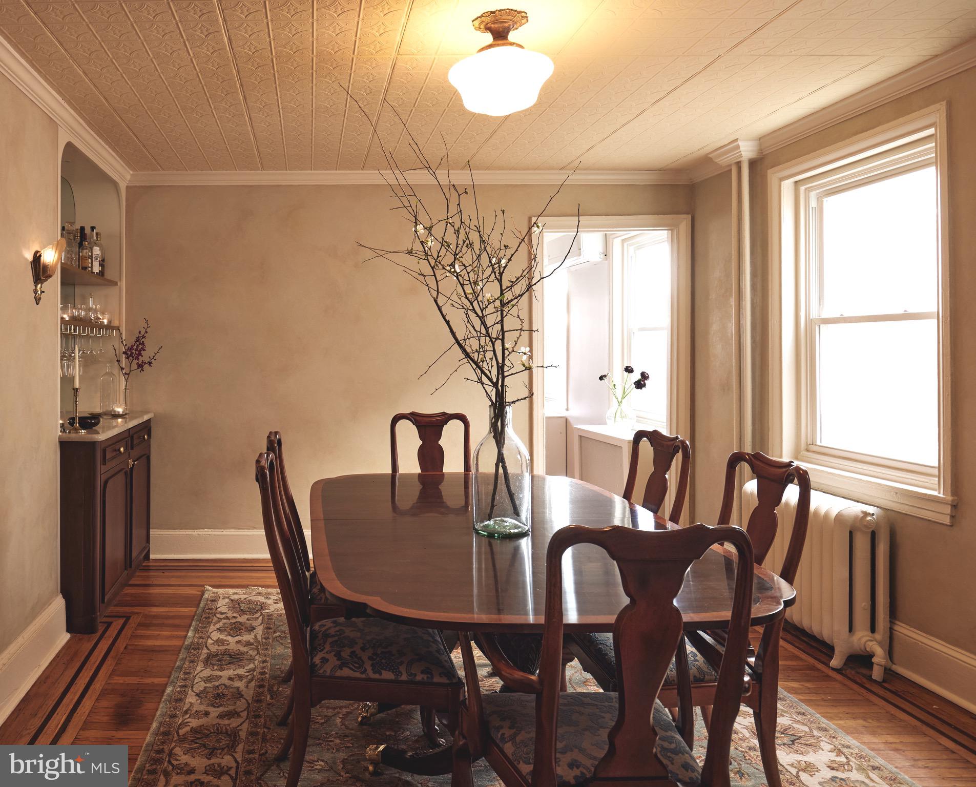 978 North 5th Street Philadelphia, PA 19123 - Photo 9 of 36 a view of a dining room with furniture window and wooden floor