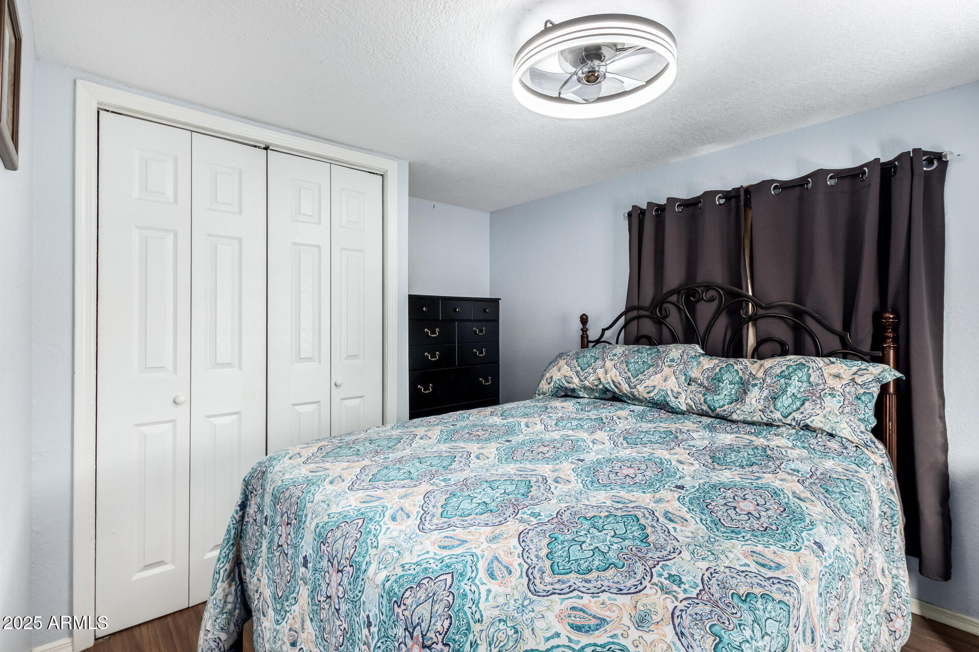 800 West Apache Trail, Unit 24 Apache Junction, AZ 85120 - Photo 15 of 27 a bedroom with a bed and a closet