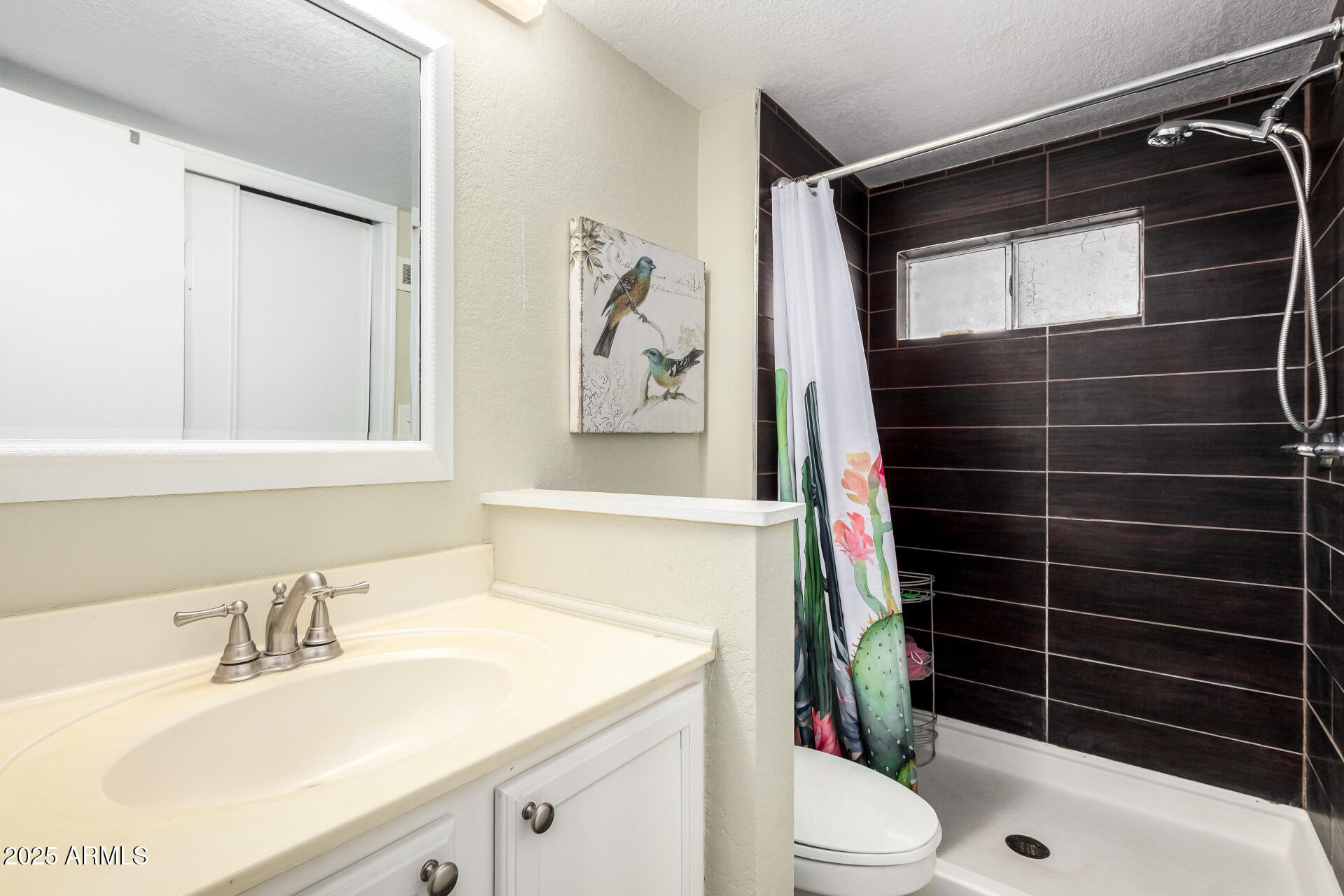 800 West Apache Trail, Unit 24 Apache Junction, AZ 85120 - Photo 19 of 27 a bathroom with a sink a toilet and shower
