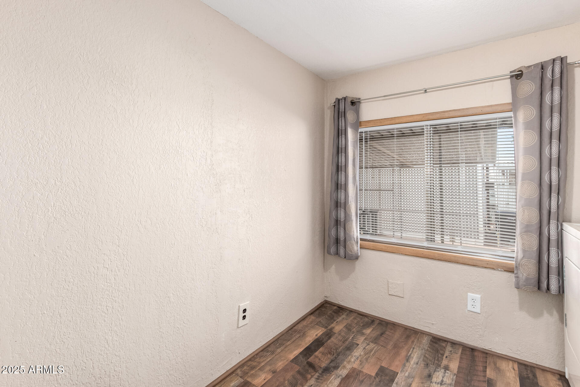 800 West Apache Trail, Unit 24 Apache Junction, AZ 85120 - Photo 20 of 27 a view of empty room with wooden floor and fan
