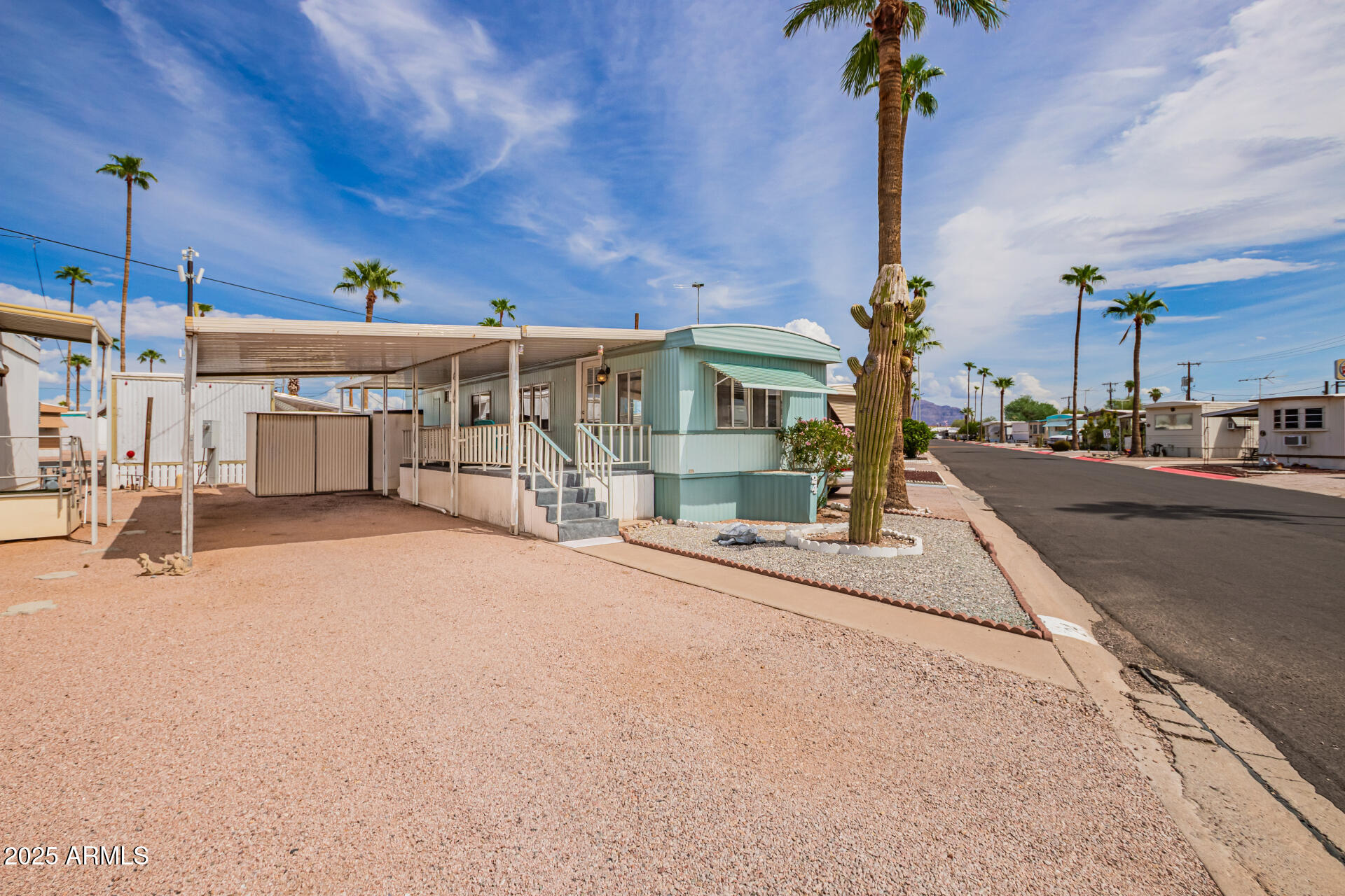 800 West Apache Trail, Unit 24 Apache Junction, AZ 85120 - Photo 3 of 27 a view of a house with a street