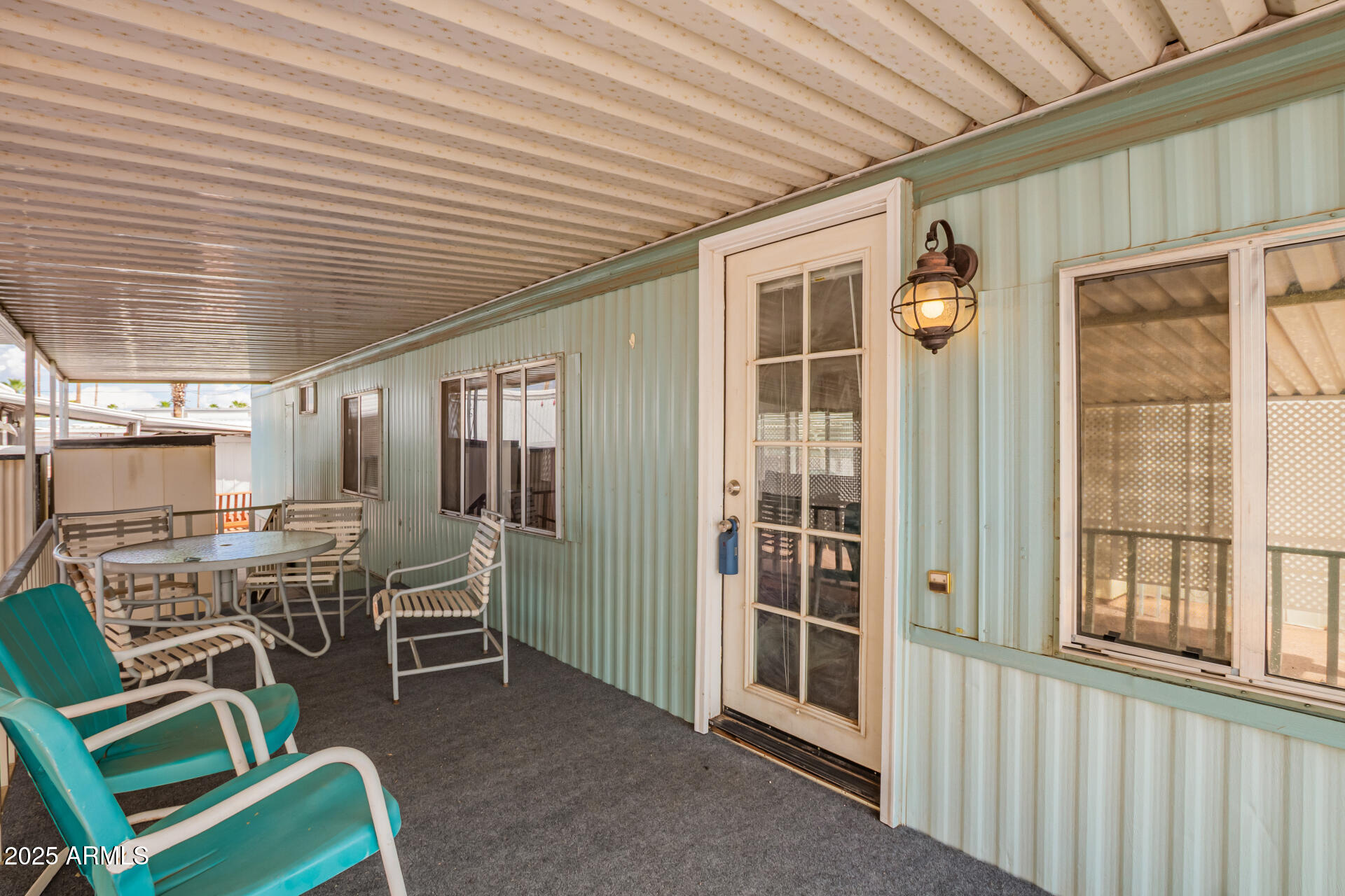 800 West Apache Trail, Unit 24 Apache Junction, AZ 85120 - Photo 6 of 27 a view of a chairs and table in a patio