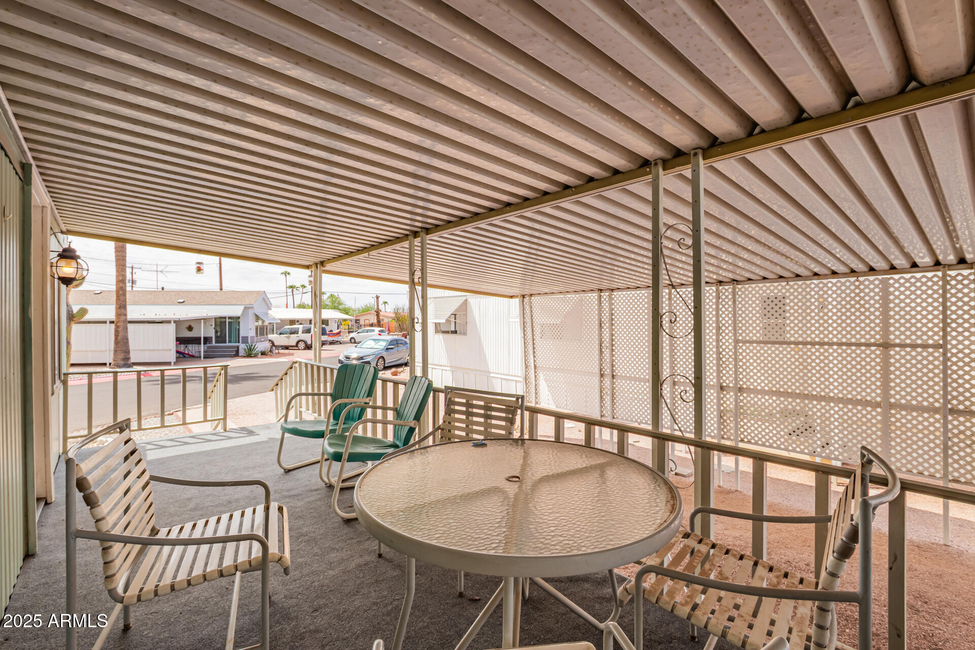 800 West Apache Trail, Unit 24 Apache Junction, AZ 85120 - Photo 8 of 27 a balcony with table and chairs