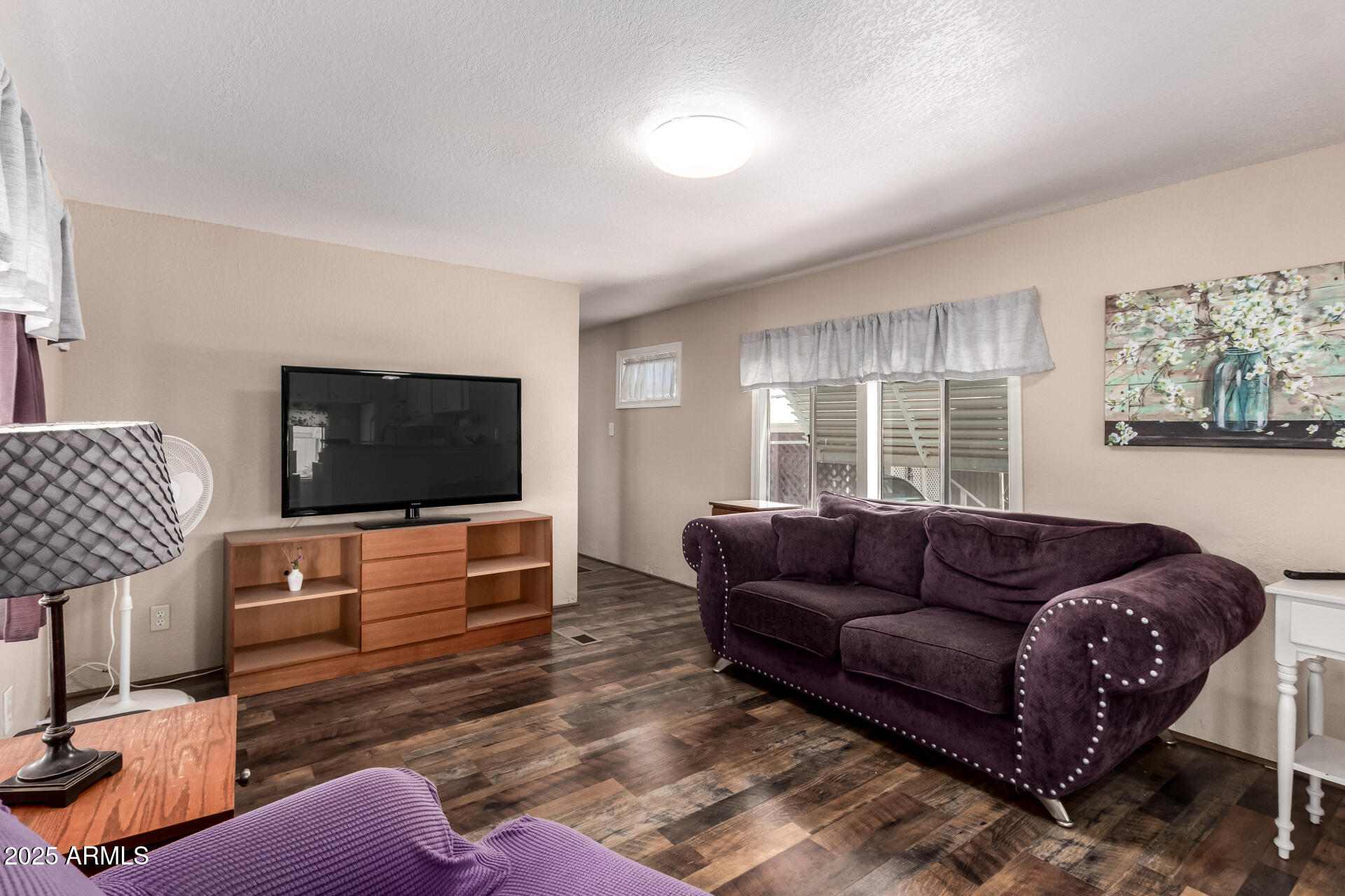 800 West Apache Trail, Unit 24 Apache Junction, AZ 85120 - Photo 9 of 27 a living room with furniture and a flat screen tv