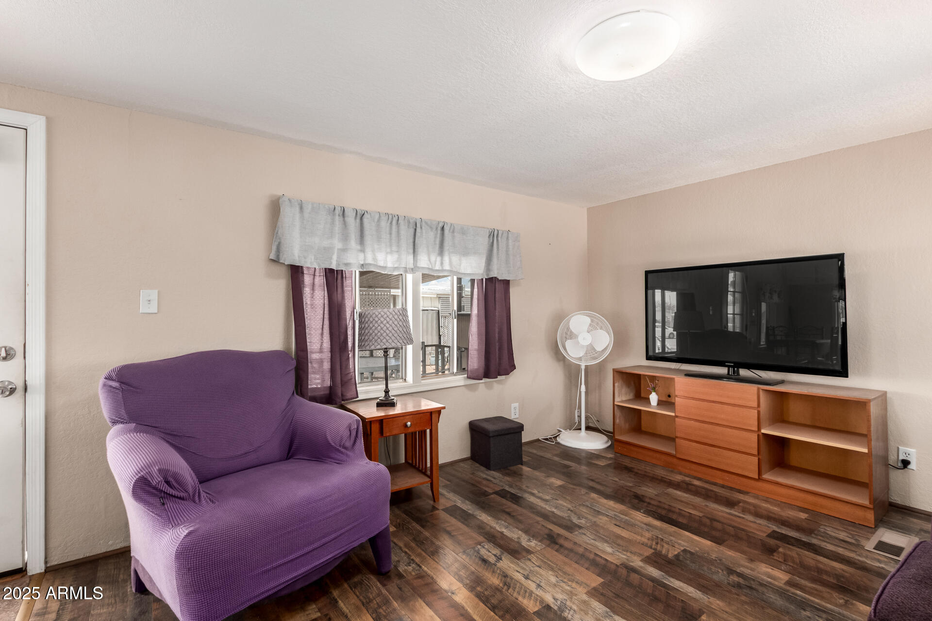 800 West Apache Trail, Unit 24 Apache Junction, AZ 85120 - Photo 10 of 27 a living room with furniture and a flat screen tv
