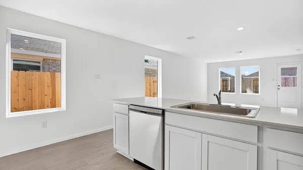 a kitchen with a sink and a window