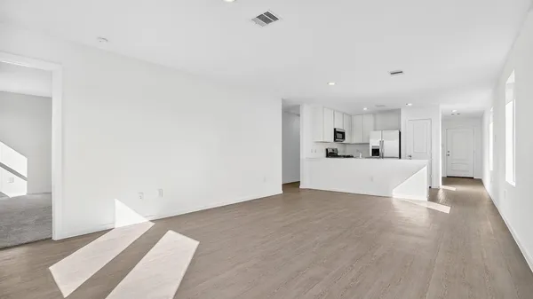 a view of a kitchen with a sink and a window