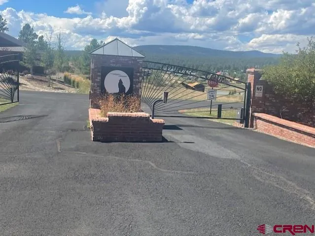 a wooden bench sitting in front of a building