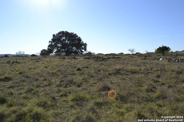 Lt 22 Stone Crest Bandera, TX 78003 - Photo 8 of 9 a view of a dry field with trees in background