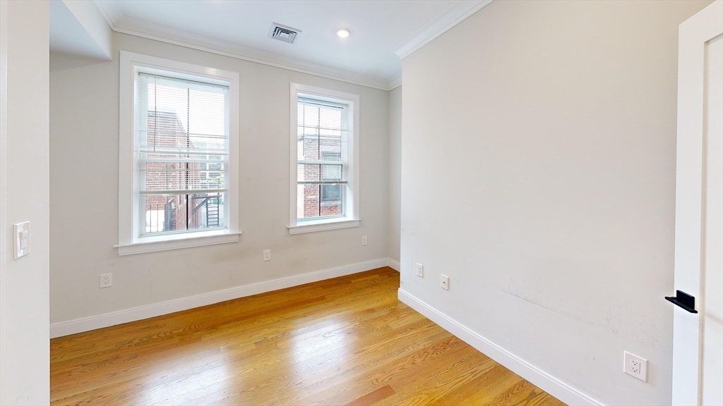 191 Porter Street, Unit 4 Boston, MA 02128 - Photo 4 of 8 a view of a room with windows