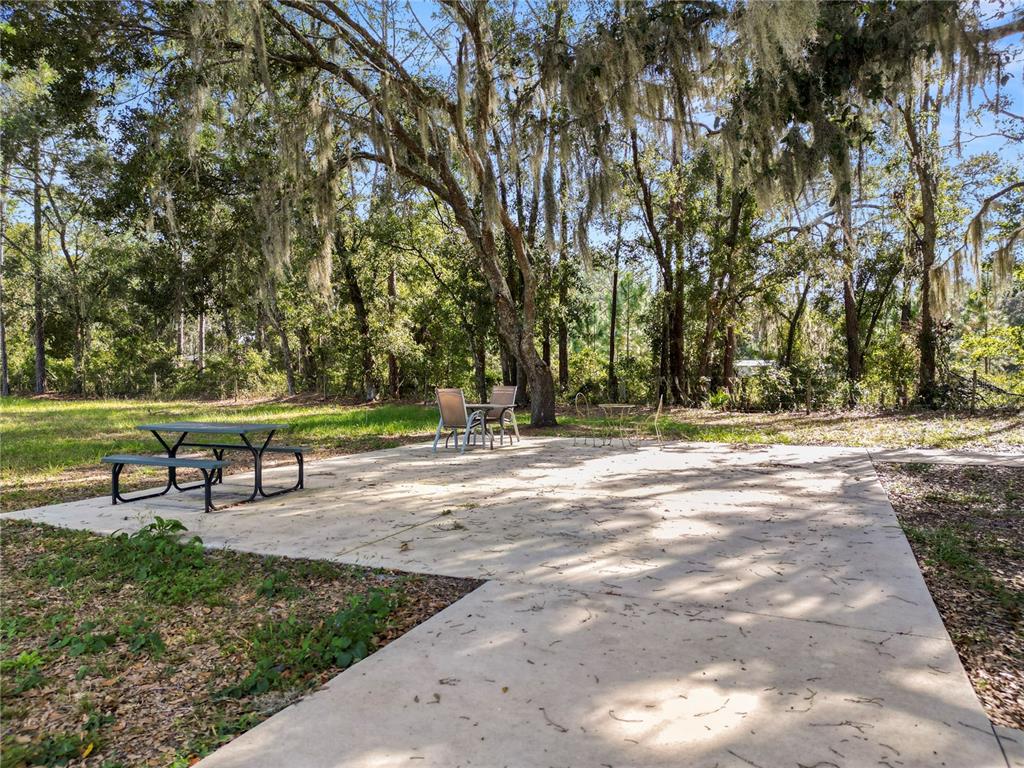 1828 Gator Creek Ranch Road Lakeland, FL 33809 - Photo 24 of 27 a park with bench and trees